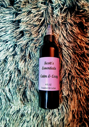 Bottle of Scott's Essentials Calm & Cozy Essential Oil Lotion on a textured surface