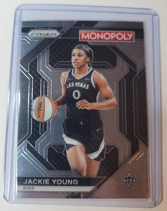 Monopoly trading card featuring basketball player Jackie Young in a black uniform with the number 0.