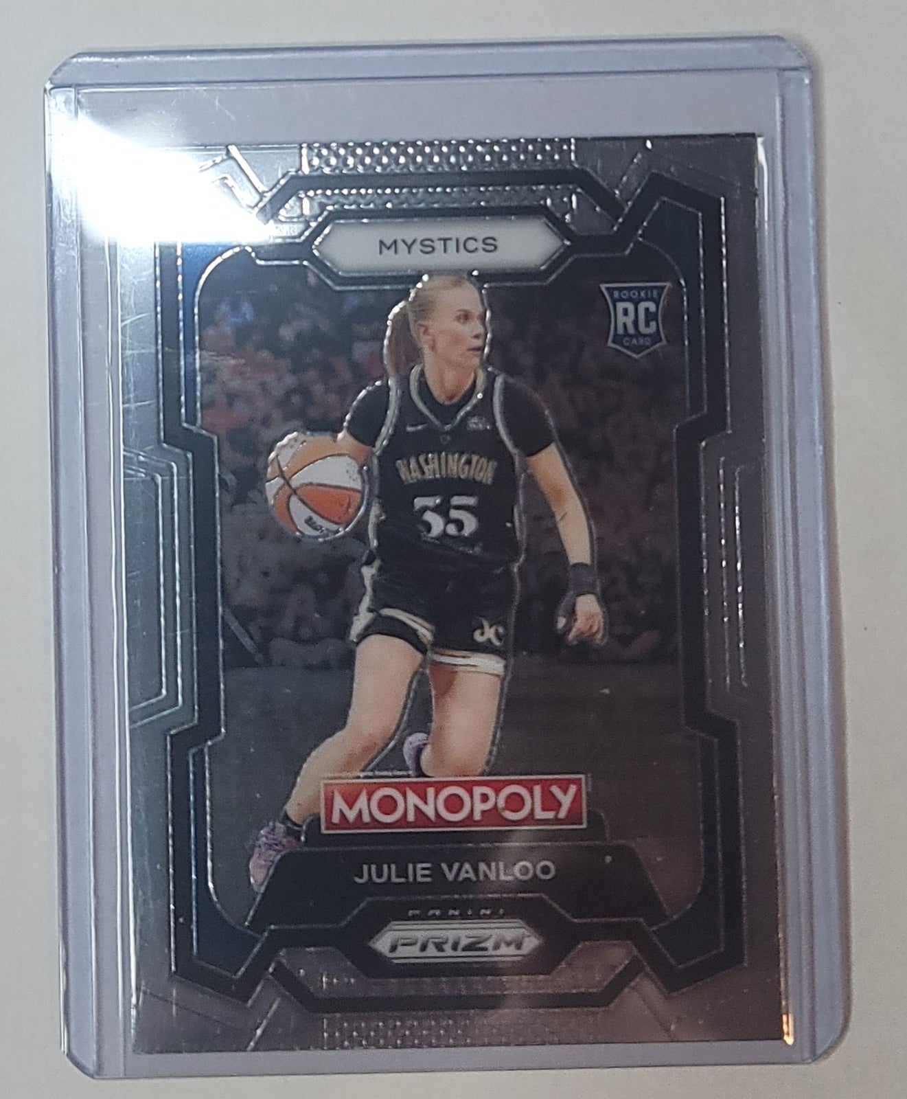 Basketball trading card of Julie Vanloo with 'Monopoly' and 'Prizm' branding on a reflective surface.