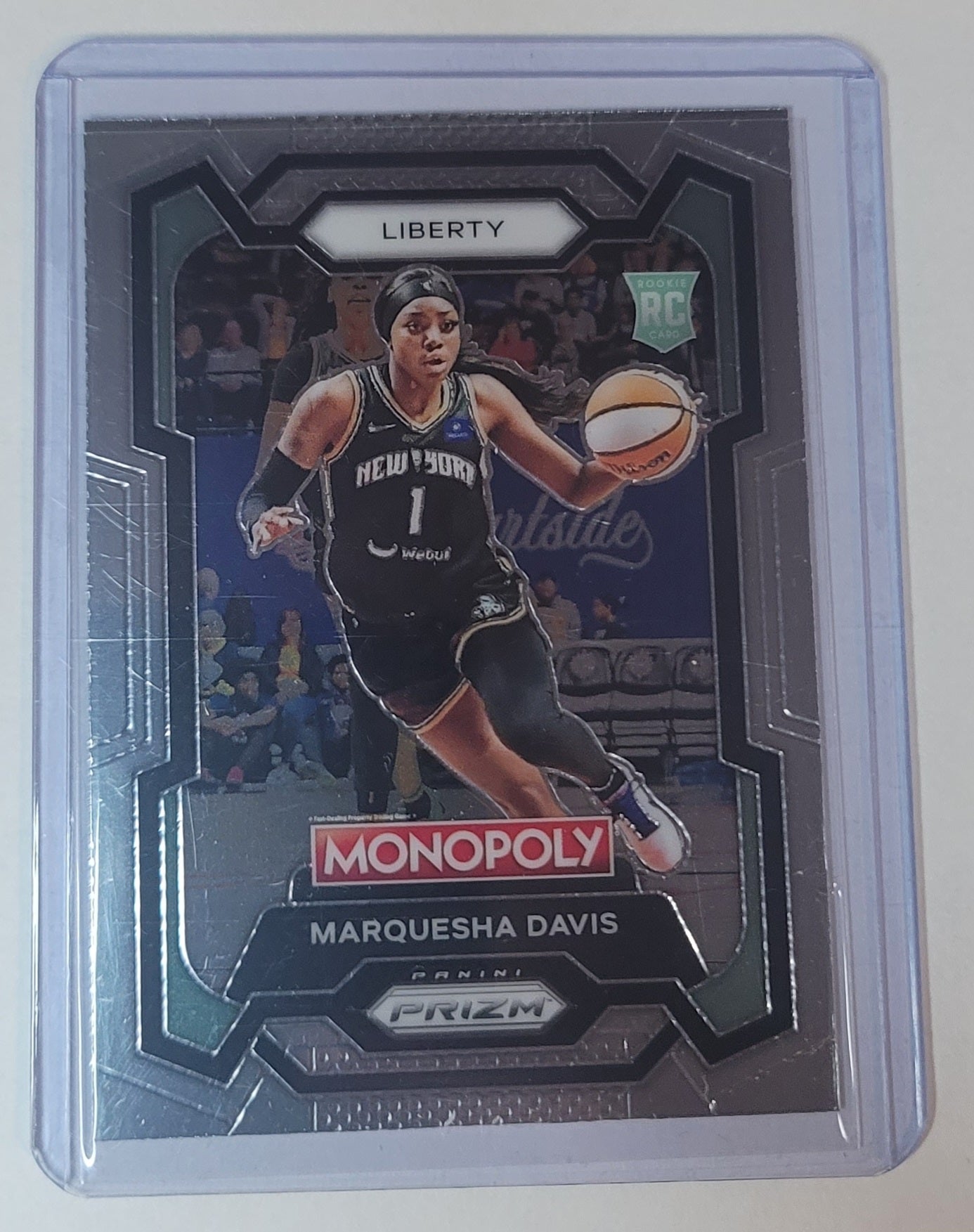 Basketball trading card of Marquesha Davis with Monopoly branding on a gray background