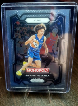 Basketball trading card featuring a player in a blue uniform with 'Monopoly' branding.