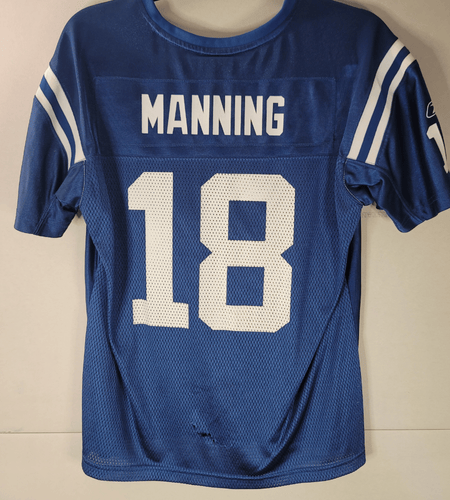 Jersey with 'Manning' and number '18' on a beige background