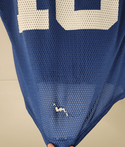 Back of Peyton Manning jersey with small tear