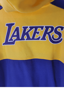 Close-up of a yellow and blue Lakers hoodie with 'LAKERS' text.