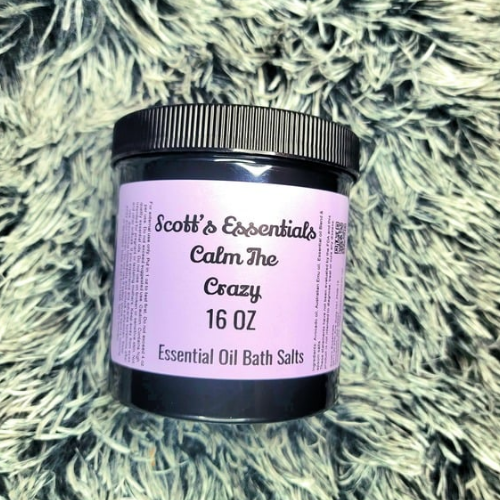 Jar of Scott's Essentials Calm The Crazy Essential Oil Bath Salts on a textured surface