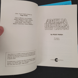 Open book with title page displaying 'Amelia Bedelia' by Peggy Parish.