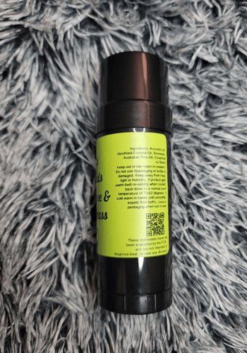 Peace, Love & Lemongrass Pain stick on a gray textured surface