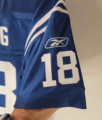 Peyton Manning jersey with number 18 and Reebok logo on right sleeve