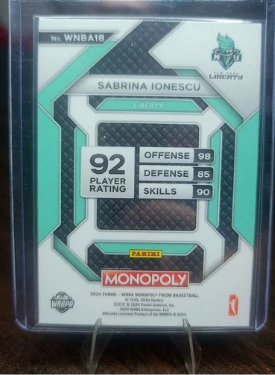 Trading card of Sabrina Ionescu with stats on a clear background