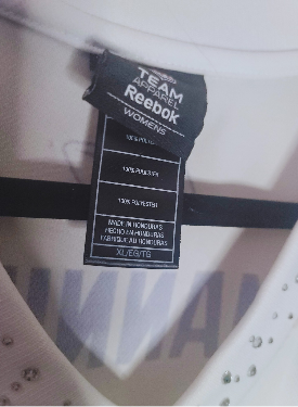 Close-up of a Reebok XL women's Peyton Manning jersey label