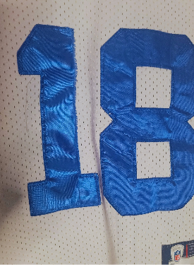 Blue number 18 on a white Peyton Manning used medium youth jersey 